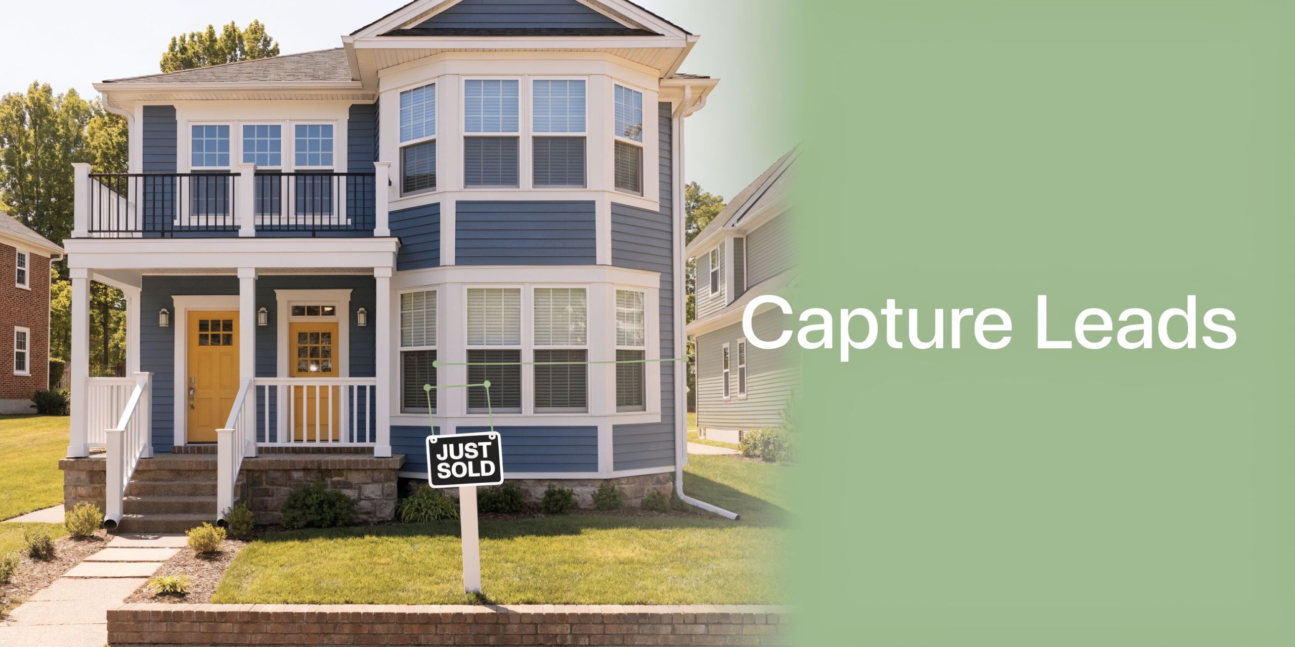 A blue two-story residential house with a Just Sold real estate sign in the front yard.