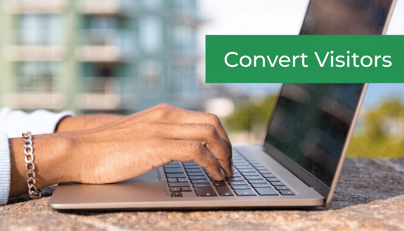 A close-up of a person typing on a laptop, with text overlay saying Convert Visitors.